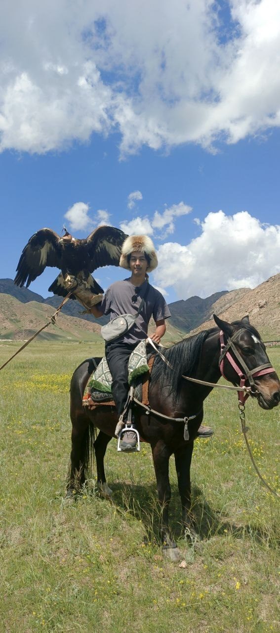 A local eagle hunter with a golden eagle